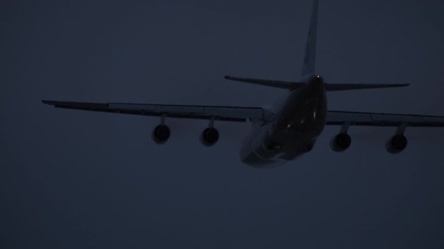 Sochi, Russia - 02.02.2020 The large transport plane AN 124 110 Ruslan takes off from the airfield. It's night time. Airport. 