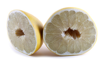 Pomelo halves isolated on white. Biggest citrus