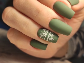 stylish manicure with a design on beautiful hands