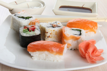 Sushi and rolls with porcelain sauce