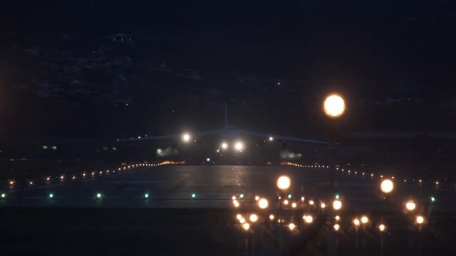 Sochi, Russia - 02.02.2020 The large transport plane AN 124 110 Ruslan takes off from the airfield. It's night time. Airport. 