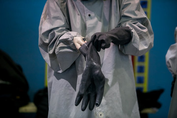 Man with protective mask and protective clothes, coronavirus protection