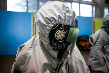 Man with protective mask and protective clothes, coronavirus protection