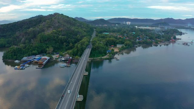 Aerial footage of Beautiful Rural village landscape with green forest in surrounding in Mengkabong River, Tuaran, Sabah, Borneo