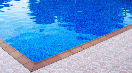 Outdoor swimming pool at summer time.