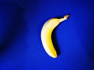 Ripe bananas on a classic blue background.