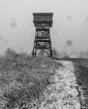 wooden view tower on Kozia Gora hill above Prudnik town in Poland during heavy snowffaling