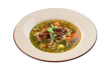 Mushrooms soup with beef rib and carrot isolated on white background