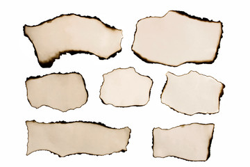Collection of burnt papers isolated on white background. Vintage charred paper. Banner. Copy space
