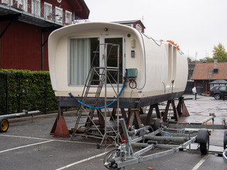 houseboat propped up on stilts on land