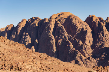 Fototapeta premium Egypt. Mount Sinai in the morning in the bright sun. (Mount Horeb, Gabal Musa, Moses Mount). Pilgrimage place and famous touristic destination.