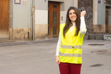 Portrait of rich attractive caucasian young woman with reflective vest taking a lot of money dollars, in the city, white top and red pants, dark air. Place for your text in copy space.