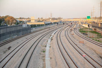 Fototapeta premium Railroad tracks in the city during daylight hours. There are no trains. There are no people. Urban style. Horizontal view.