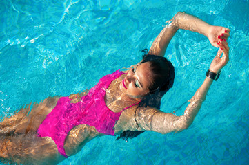 Sexy girl in a swimsuit in the pool..