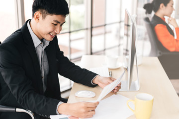 Portrait of happy smile office business asian salary man working with relax.