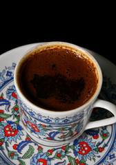 cup of Turkish coffee on black background