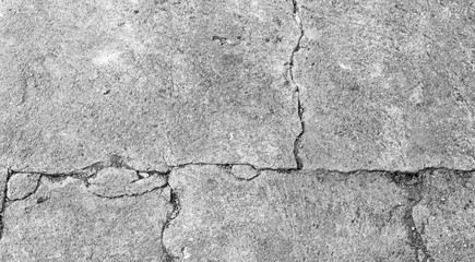 Obraz premium Black and white texture background floor of caraked cement garage.