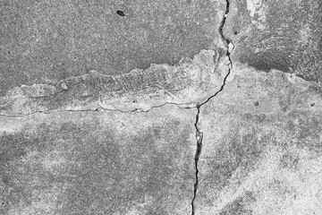 Obraz premium Black and white texture background floor of caraked cement garage.