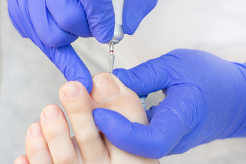 Therapeutic pedicure. Master podologist does hardware pedicure. visit to the podiatry. Foot...