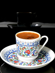 cup of Turkish coffee on black background