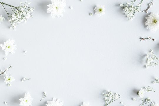 Flowers composition. White flowers on gray background. Spring concept. Flat lay, top view, copy space