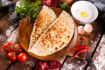 Azerbaijani national cuisine is distinguished by kutabs on a plate.