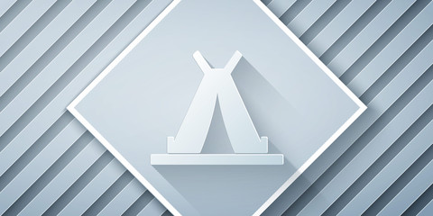 Paper cut Traditional indian teepee or wigwam icon isolated on grey background. Indian tent. Paper art style. Vector Illustration © Vadim