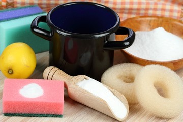 Baking soda (sodium bicarbonate)  in a spoon and lemon