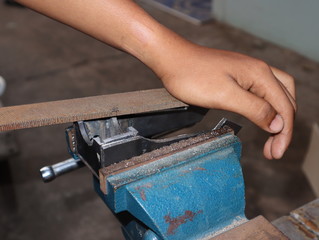 worker  working on a vice grip 