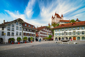 Amazing view of City Hall square and castle of Thun, Switzerland under picturesque sky