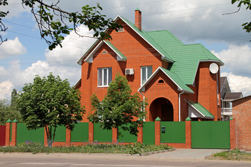 Facade of a modern brick cottage.