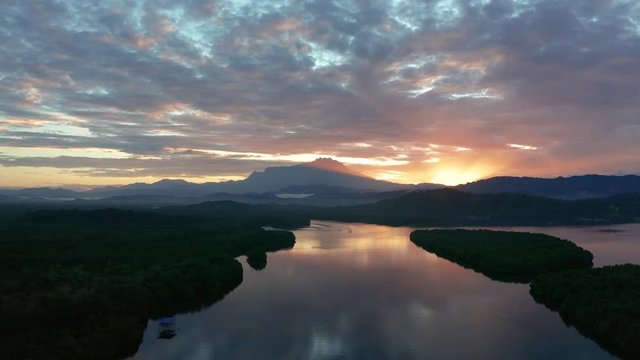 Aerial 4K footage of beautiful sunrise landscape scenery at Mengkabong River Tuaran, Sabah, Malaysia 
