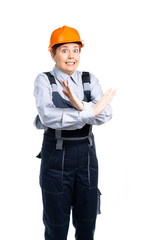 the builder girl is scared. With a gesture of her hand, she shows a stop. Isolated
