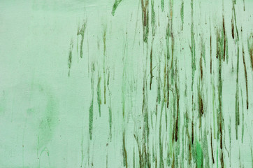 Old concrete wall with paint stains.