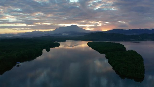 Aerial 4K footage of beautiful sunrise landscape scenery at Mengkabong River Tuaran, Sabah, Malaysia 