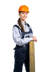 Girl builder with a wooden board in her hands. isolated
