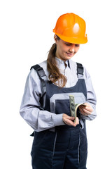 The girl in a building uniform does the calculation of the money earned. Dollars in the hands of a woman delight her. Isolated.