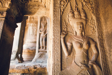 Walls decorated with wall carvings at Angkor Wat Temple. Siem Reap, Cambodia.