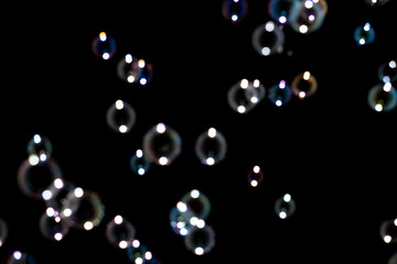 Blurred of Bubble on black background, Bokeh with background.