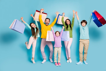 Full length body size view of nice attractive glad cheerful big full family carrying bag new thing...