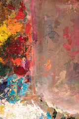 Background image of bright oil-paint palette closeup.