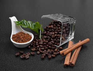Coffee beans and  cinnamon on  background