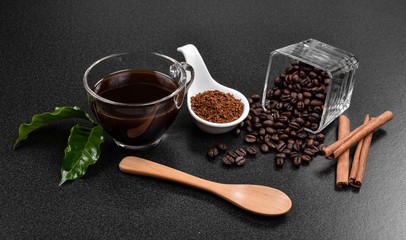 Coffee beans and  cinnamon on  background