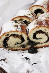 Delicious roll with poppy seeds on the table