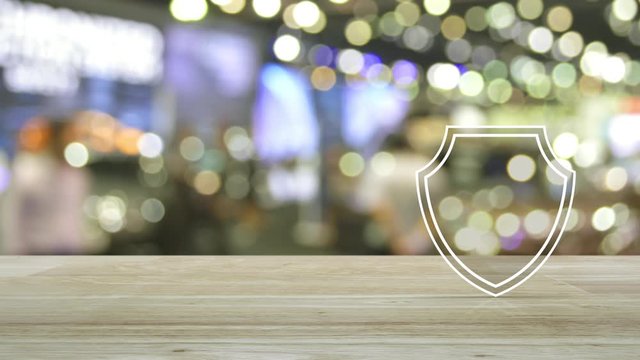 Security shield with check mark flat icon on wooden table over blur light and shadow of shopping mall, Technology internet cyber security and anti virus concept