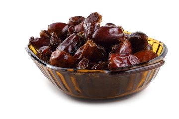 Date fruits on plate isolated on white