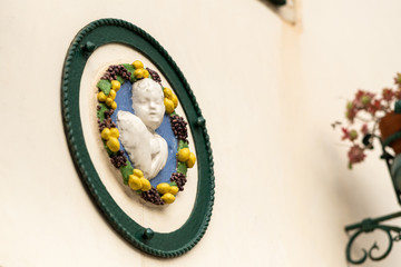 Relief on a house in Venice on a cloudy day in winter