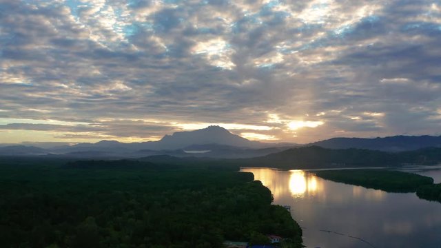 Aerial 4K footage of beautiful sunrise landscape scenery at Mengkabong River Tuaran, Sabah, Malaysia 