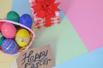 Easter, Easter egg color vibrant, spring Orthodox holiday. colorful decorated eggs in a pink basket on a background of different colors
