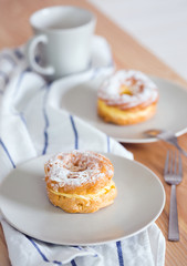 brewing cake and cup of tea nearby